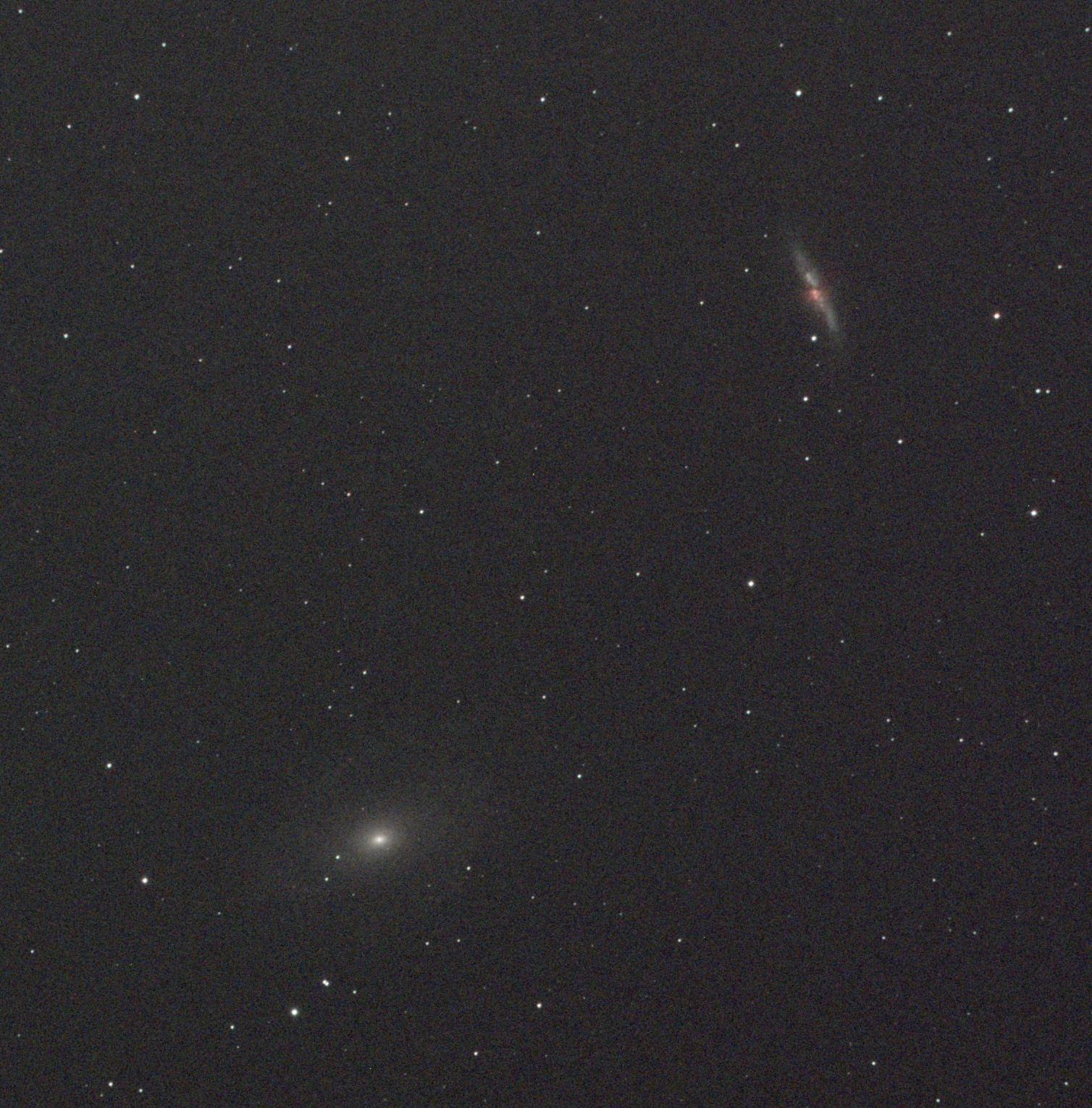 Dark starfield with several faint galaxies