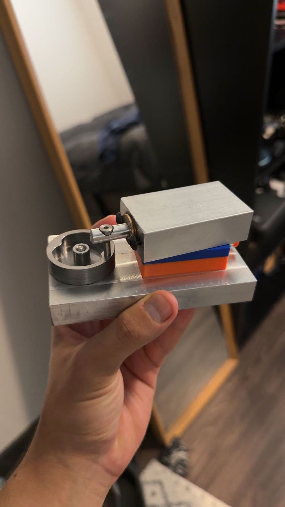 Full view of the finished compressed-air engine resting on its 3D-printed support stands