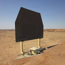 A Theissen armor target panel raised on its lifter at a desert live-fire range